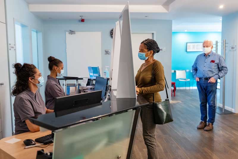 patients checking in at a clinic