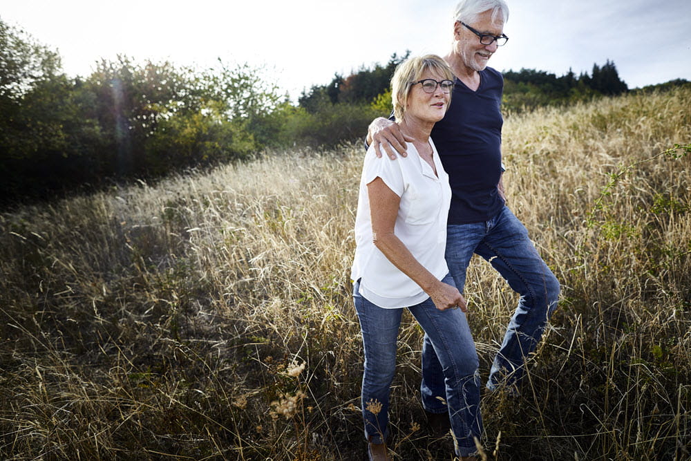 couple walking in field