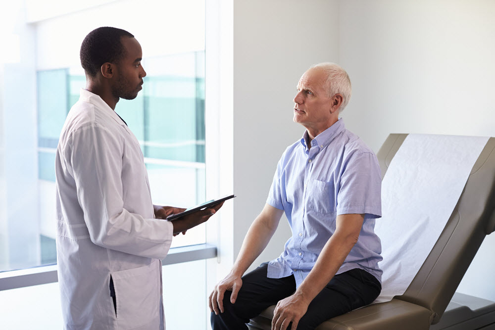 male patient talking to doctor