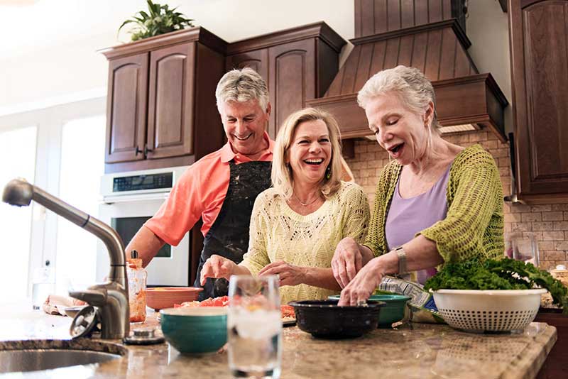 family cooking in kitchen