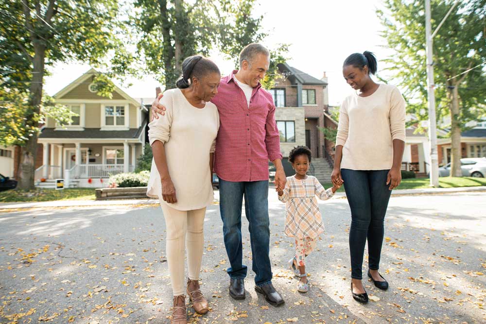 Family standing on their street