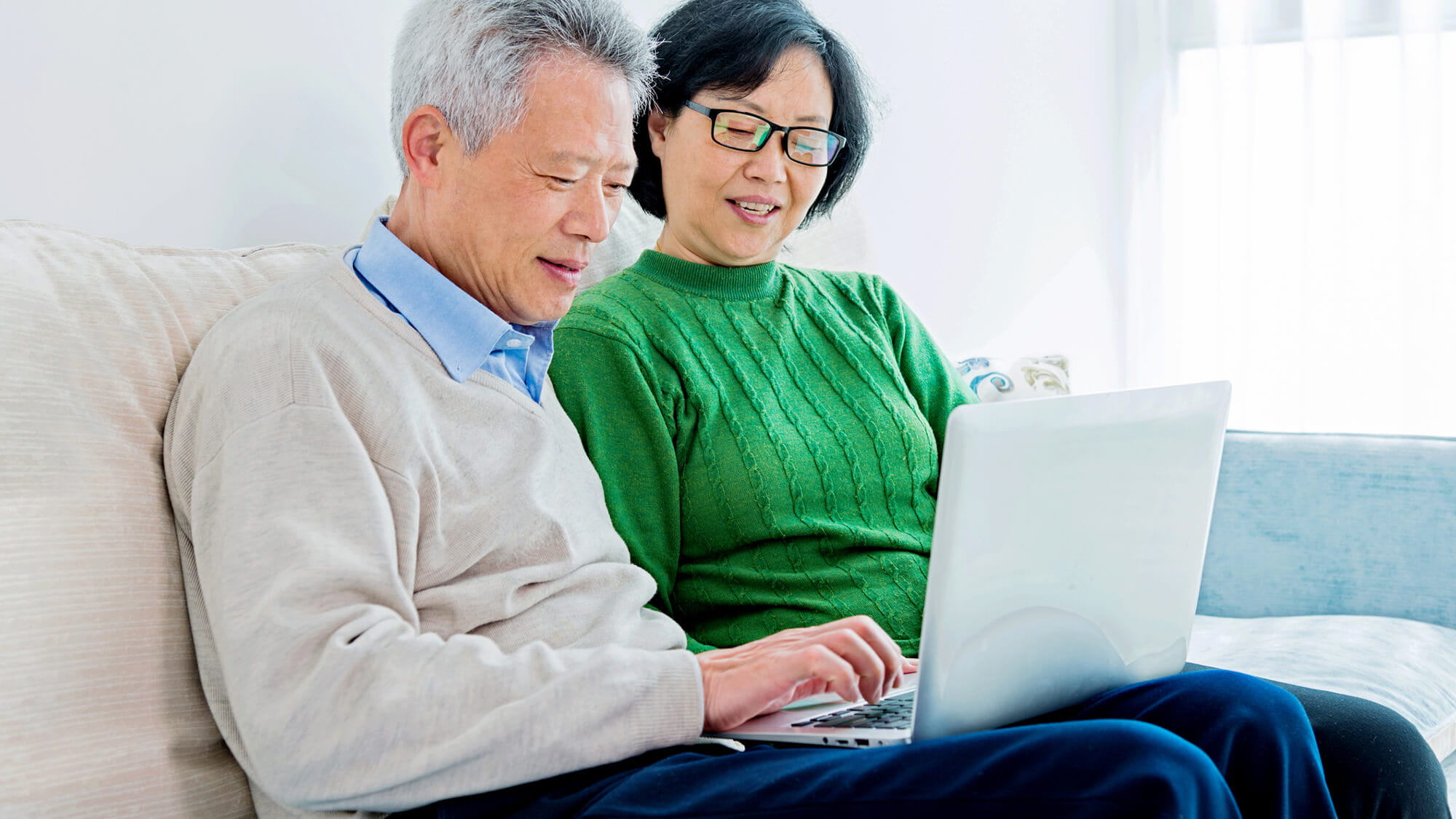 couple using laptop